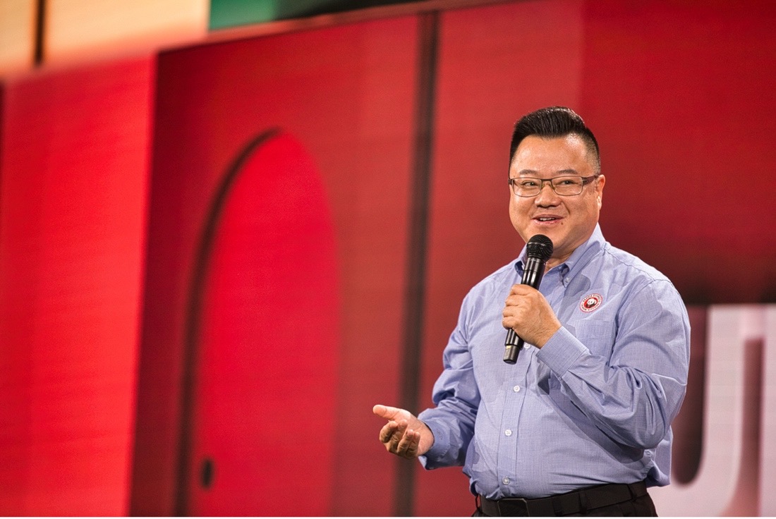 Wang speaking onstage at the 2025 Panda Leaders Conference