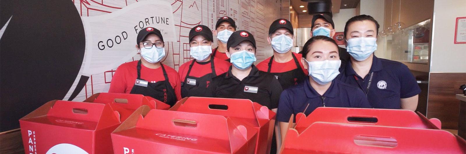 Panda Associates carrying boxes